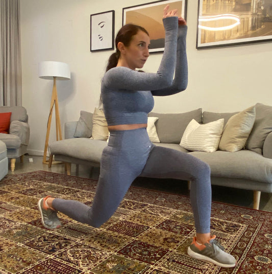 fitness girl doing home workout in grey activewear