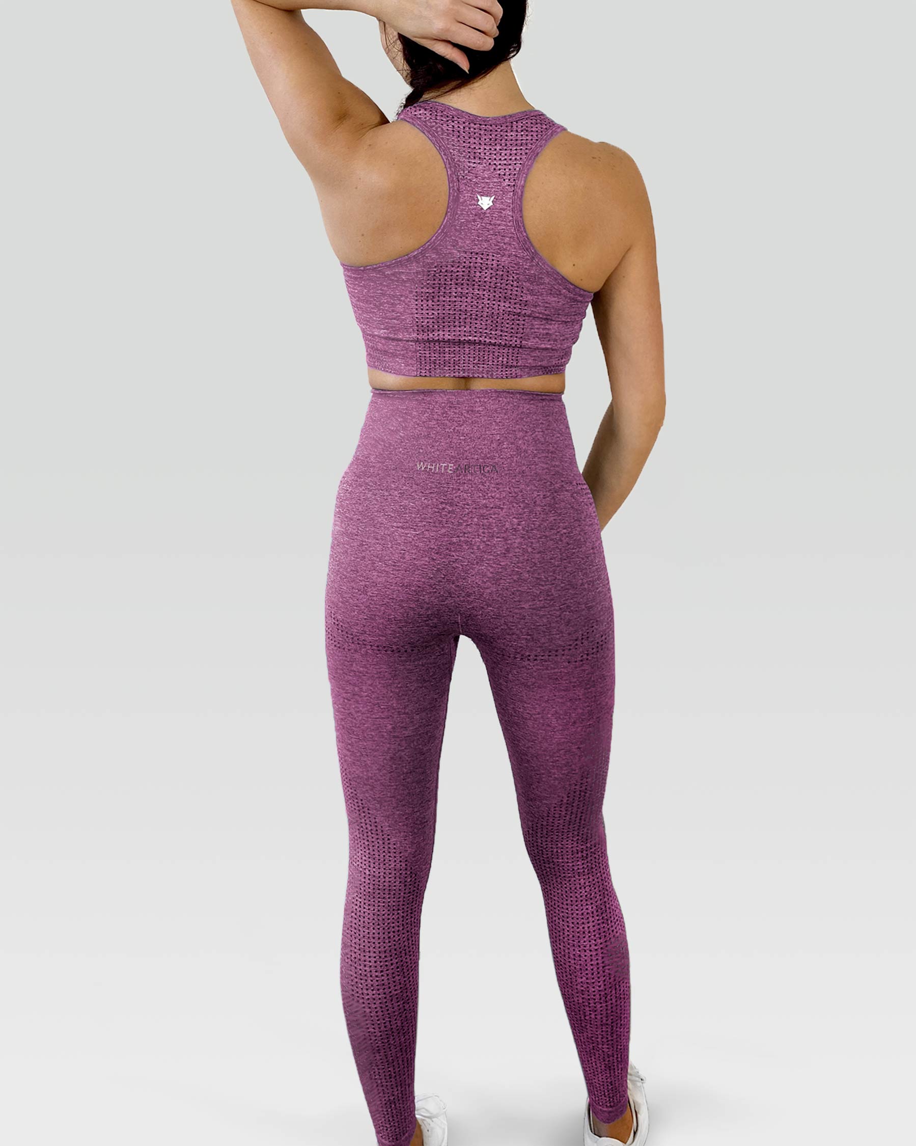 Australian woman wearing white artica high-waisted exercise pants and leggings activewear for her purple supportive activewear workout fitness cloths